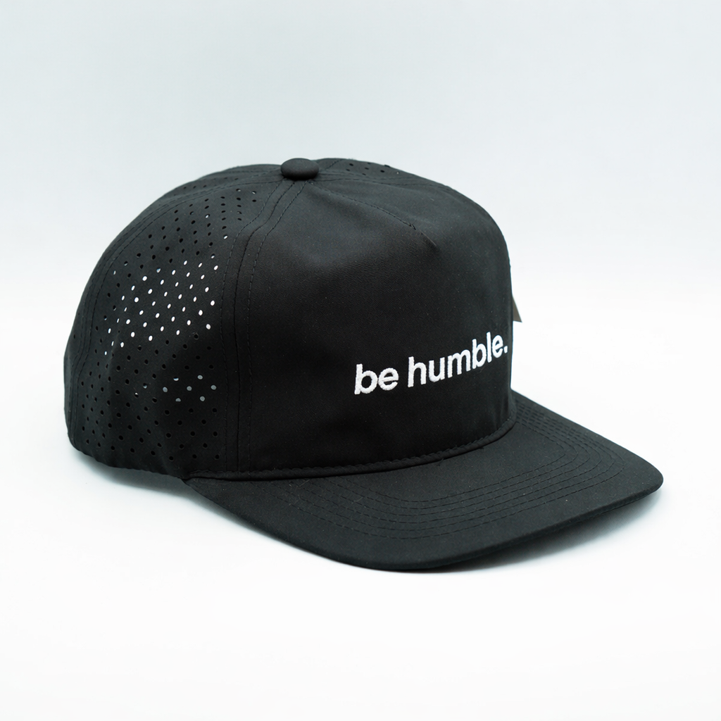 "be humble." performance golf cap, angled view