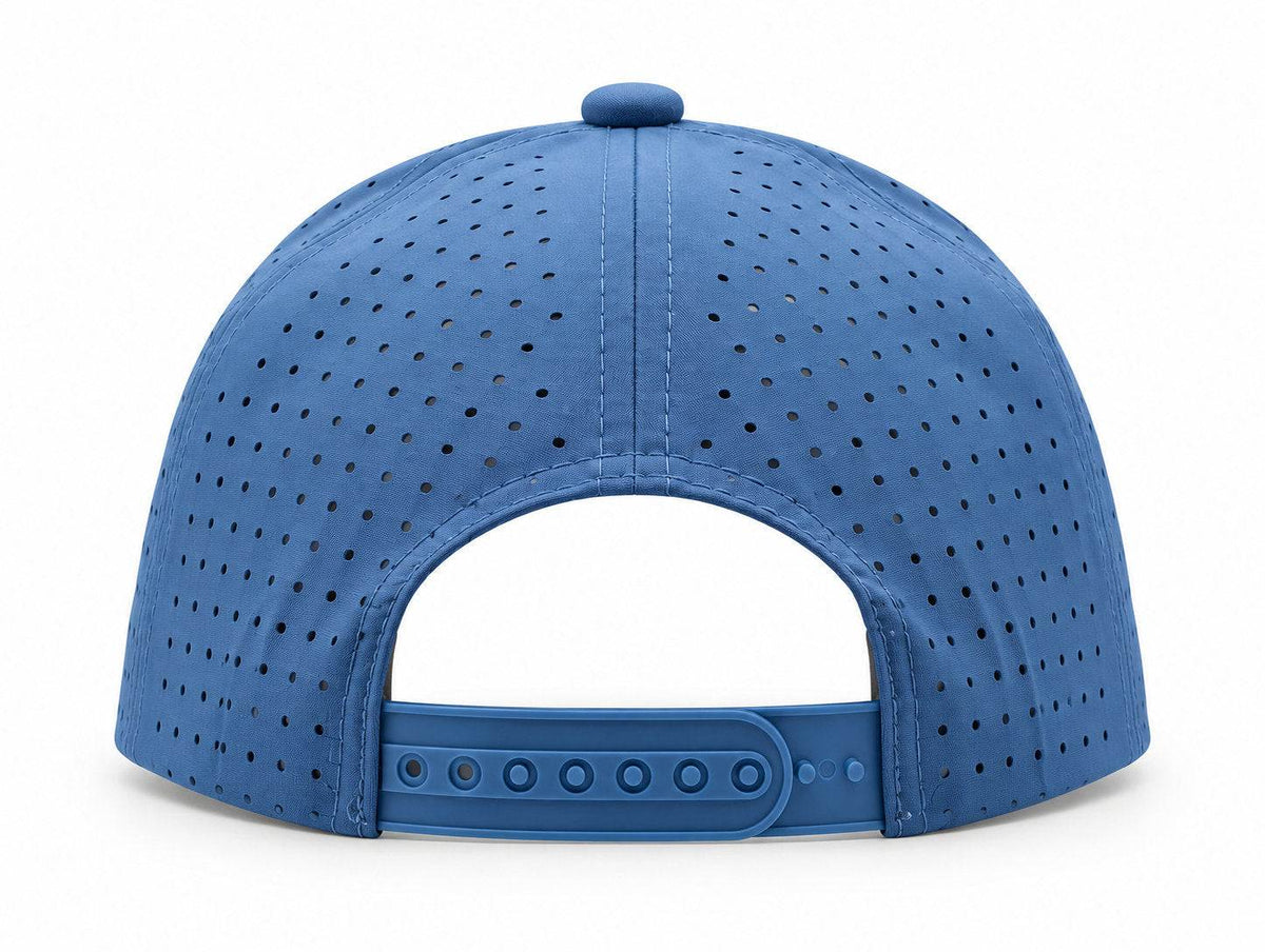 Back of the blue MOJA Kids cap showing laser-cut ventilation holes and the adjustable snapback closure