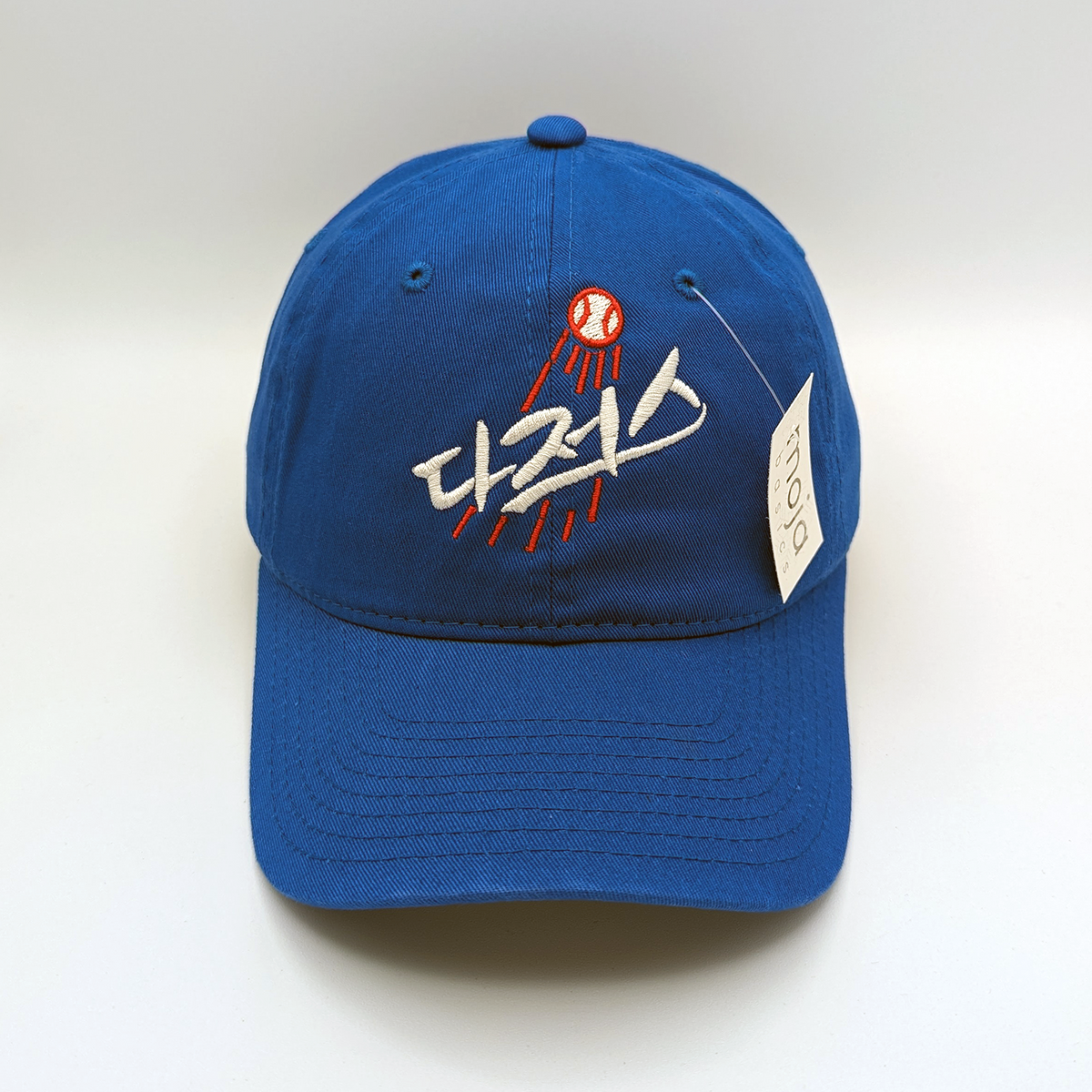 Korean Dodgers Dad Hat in royal blue cotton with cream Korean lettering and a red-and-white baseball embroidery.