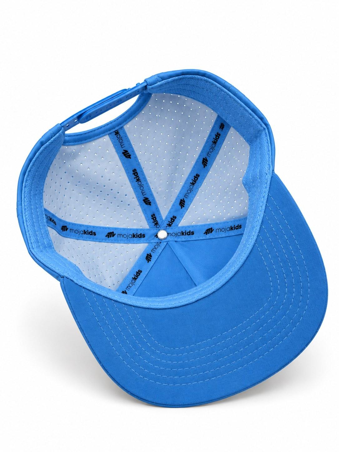 Blue MOJA Kids cap interior showing branded seam tape and laser-cut ventilation
