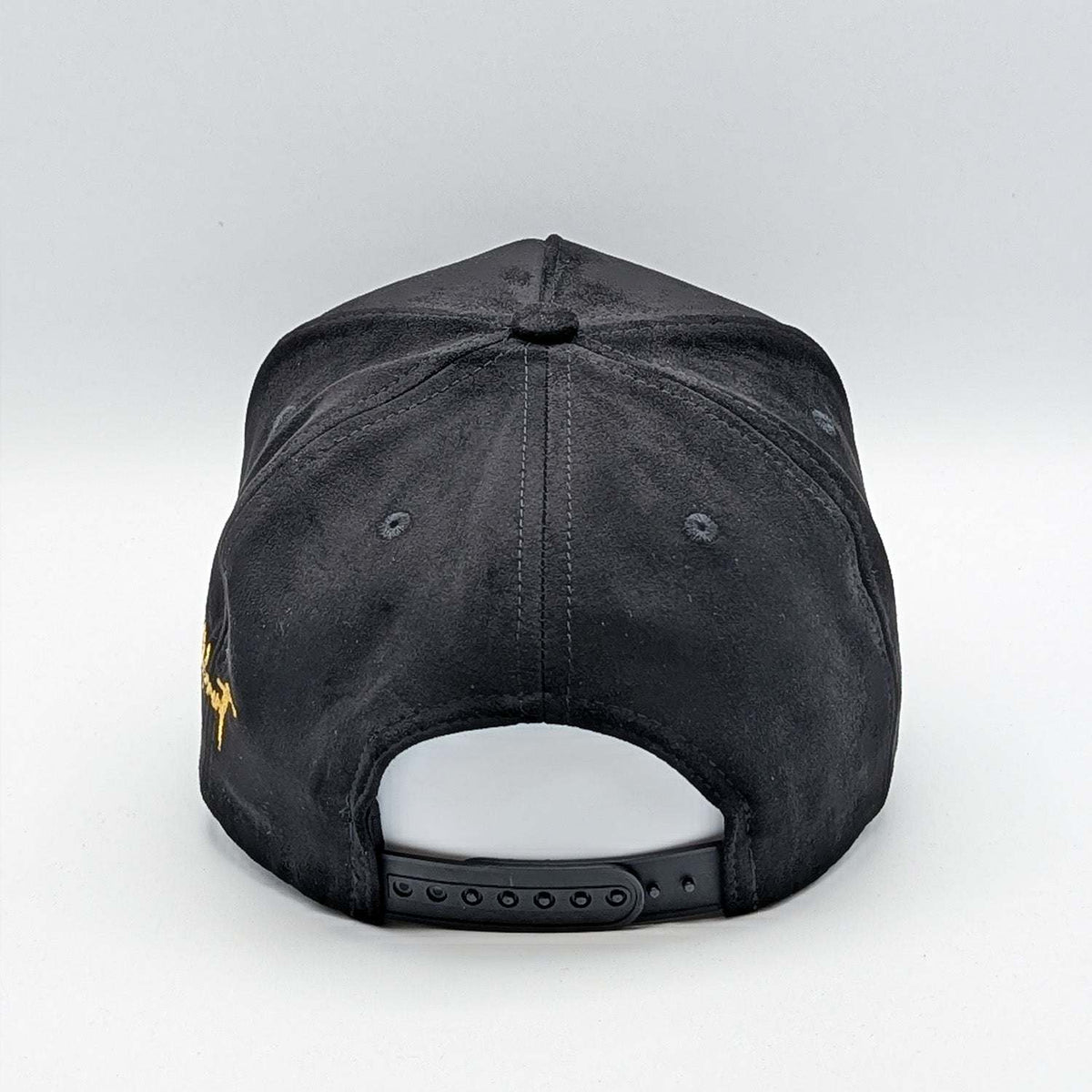 Relax - Premium Suede Snapback Hat in black suede-like fabric, with an adjustable plastic snapback and yellow embroidery at the side