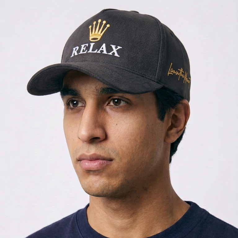 Relax - Premium Suede Snapback Hat in black with gold crown embroidery, white RELAX lettering and side script