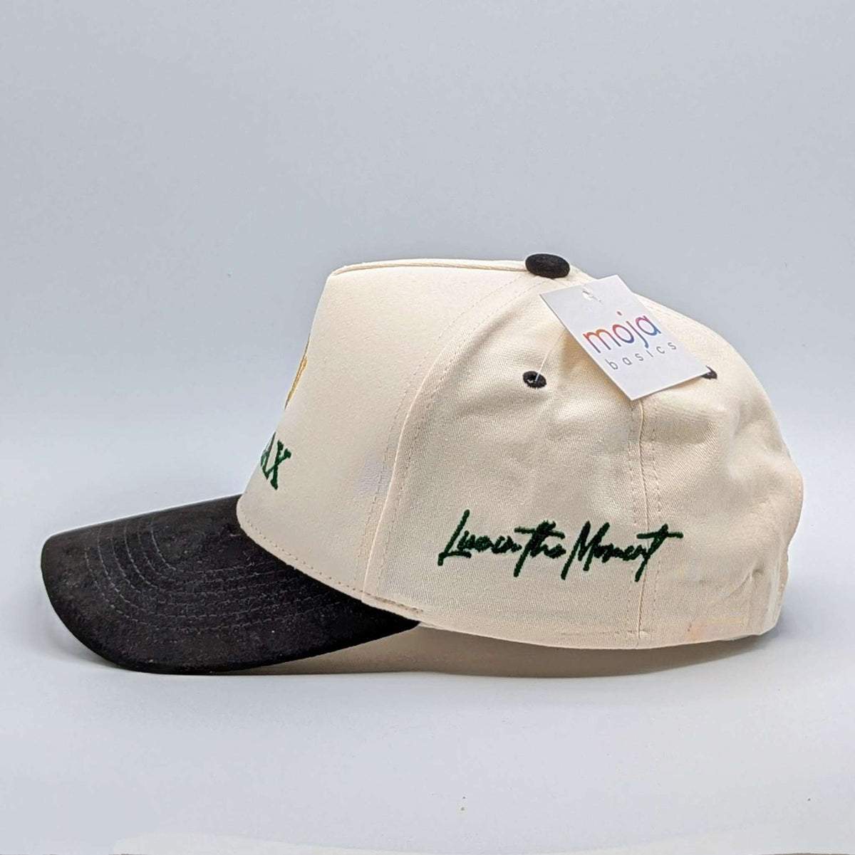 Relax - Premium Suede Snapback Hat in cream with a black suede brim and dark green embroidered lettering