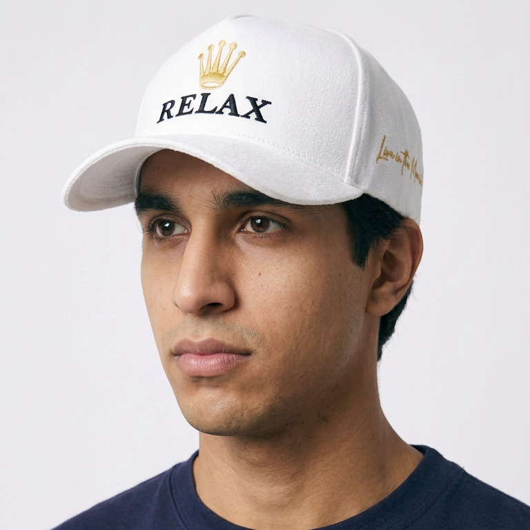 Relax - Premium Suede Snapback Hat in white with a curved brim, gold crown embroidery, and black RELAX lettering
