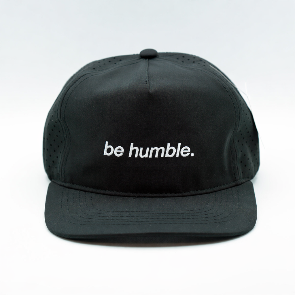 "be humble." performance golf cap, front view
