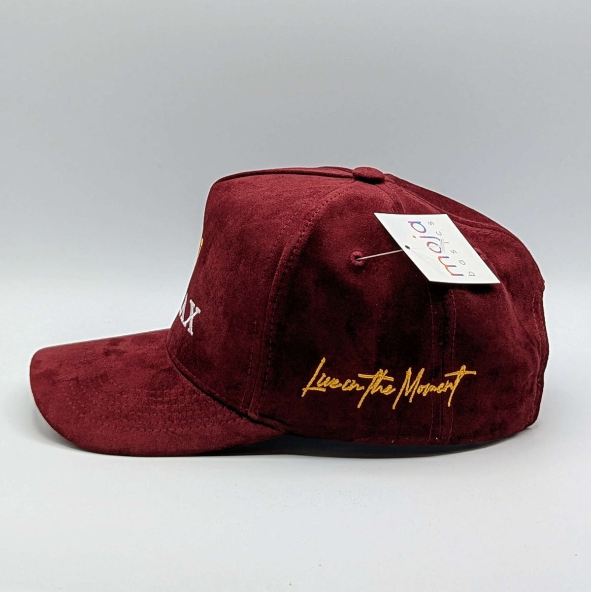 Relax - Premium Suede Snapback Hat in burgundy suede with a curved brim and gold “Live in the Moment” embroidery