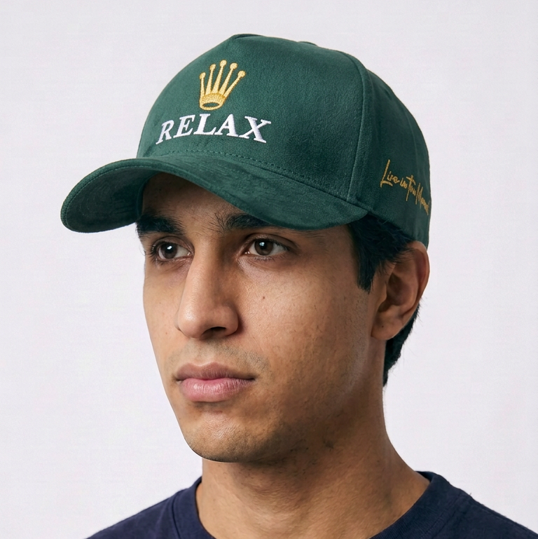 Relax - Premium Suede Snapback Hat in deep green suede-like fabric, with white RELAX embroidery and a gold crown emblem