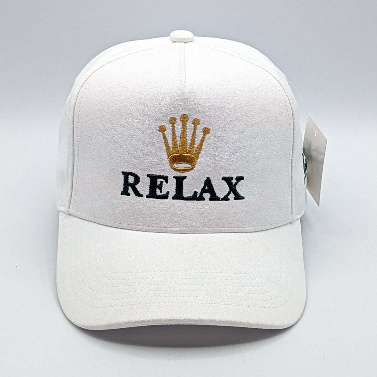 Relax - Premium Suede Snapback Hat in white with a structured five-panel crown, curved brim, and embroidered gold crown and black RELAX lettering
